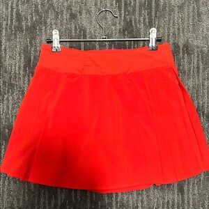 Lululemon Side-Pleat High-Rise Tennis Skirt in
Hot Heat
